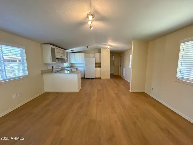 a view of a kitchen with a sink cabinets and window