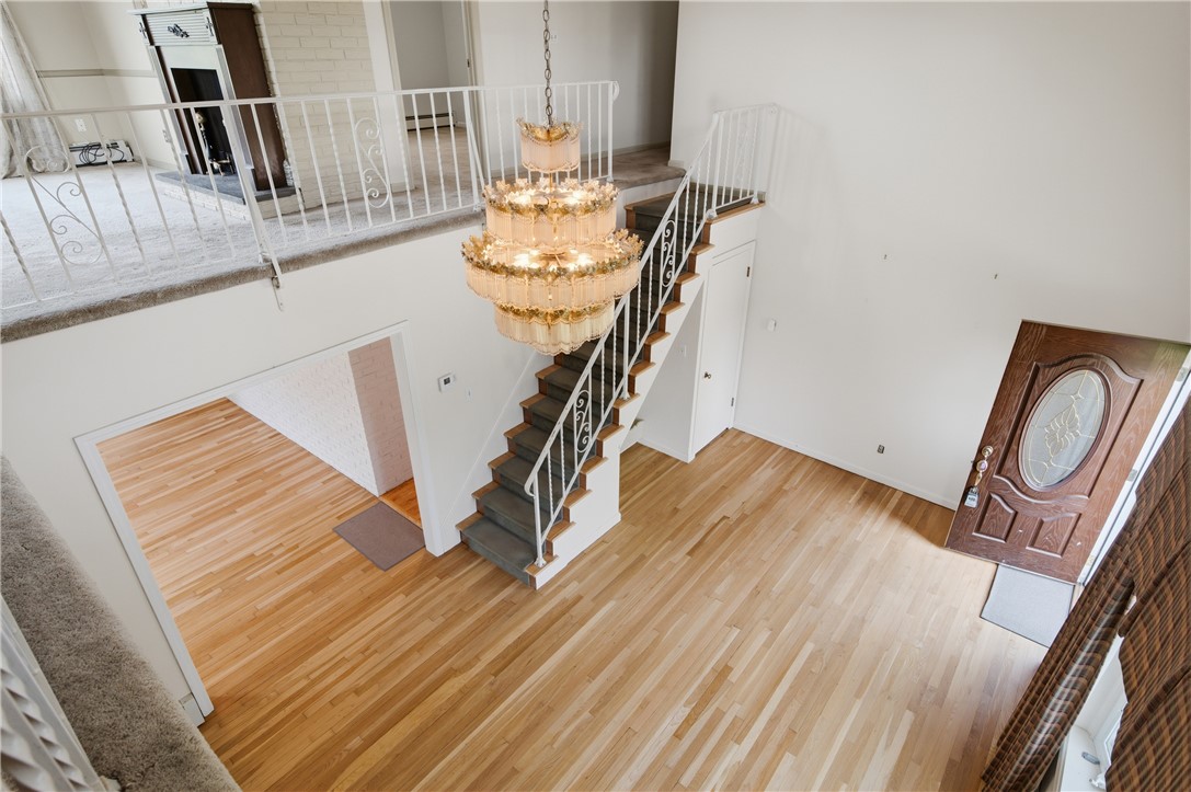 16 Old Simmonsville Road Johnston, RI 02919 - Photo 31 of 37 This is a living room with stairs to the second floor and a view from upstair's Sitting room