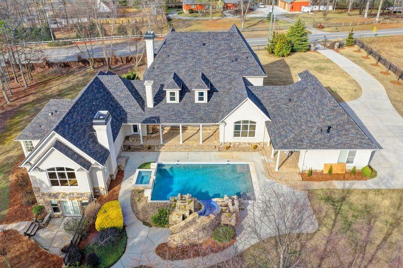 4045 Ridge Road Buford, GA 30519 - Photo 96 of 97 a aerial view of a house with swimming pool and sitting area