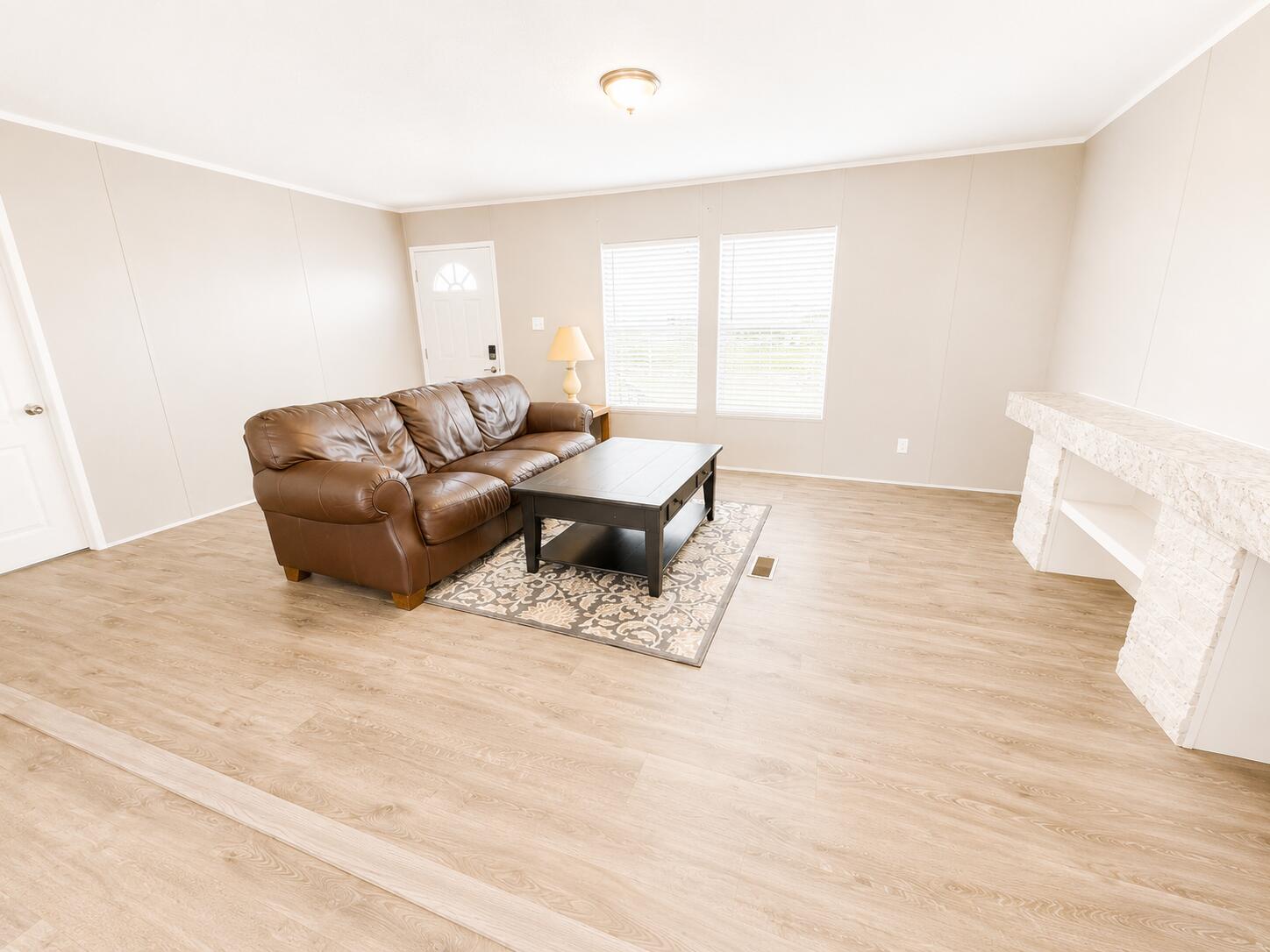 1121 Orange Loop Okeechobee, FL 34974 - Photo 11 of 33 Bright Minimalist Living Room with Leath