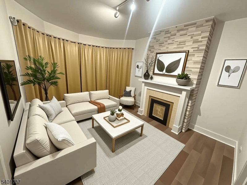 751 East 25th Street, Unit 2 Paterson, NJ 07504 - Photo 3 of 8 a living room with furniture and a fireplace