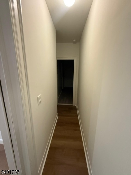 751 East 25th Street, Unit 2 Paterson, NJ 07504 - Photo 8 of 8 a view of a hallway with wooden floor