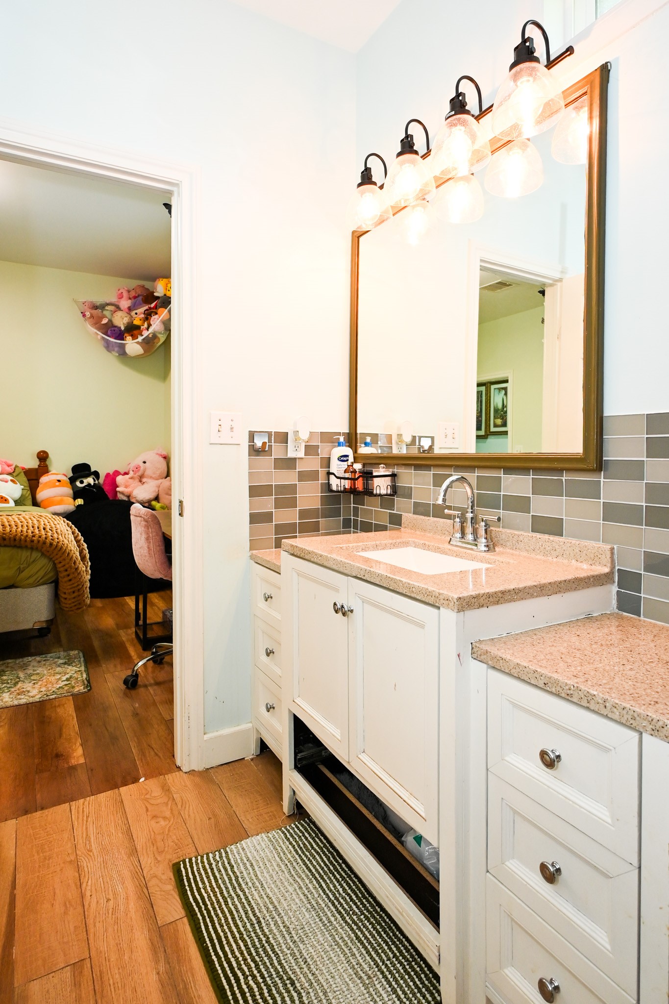 1229 County Road 2209N Cleveland, TX 77327 - Photo 15 of 43 a bathroom with a sink and a mirror