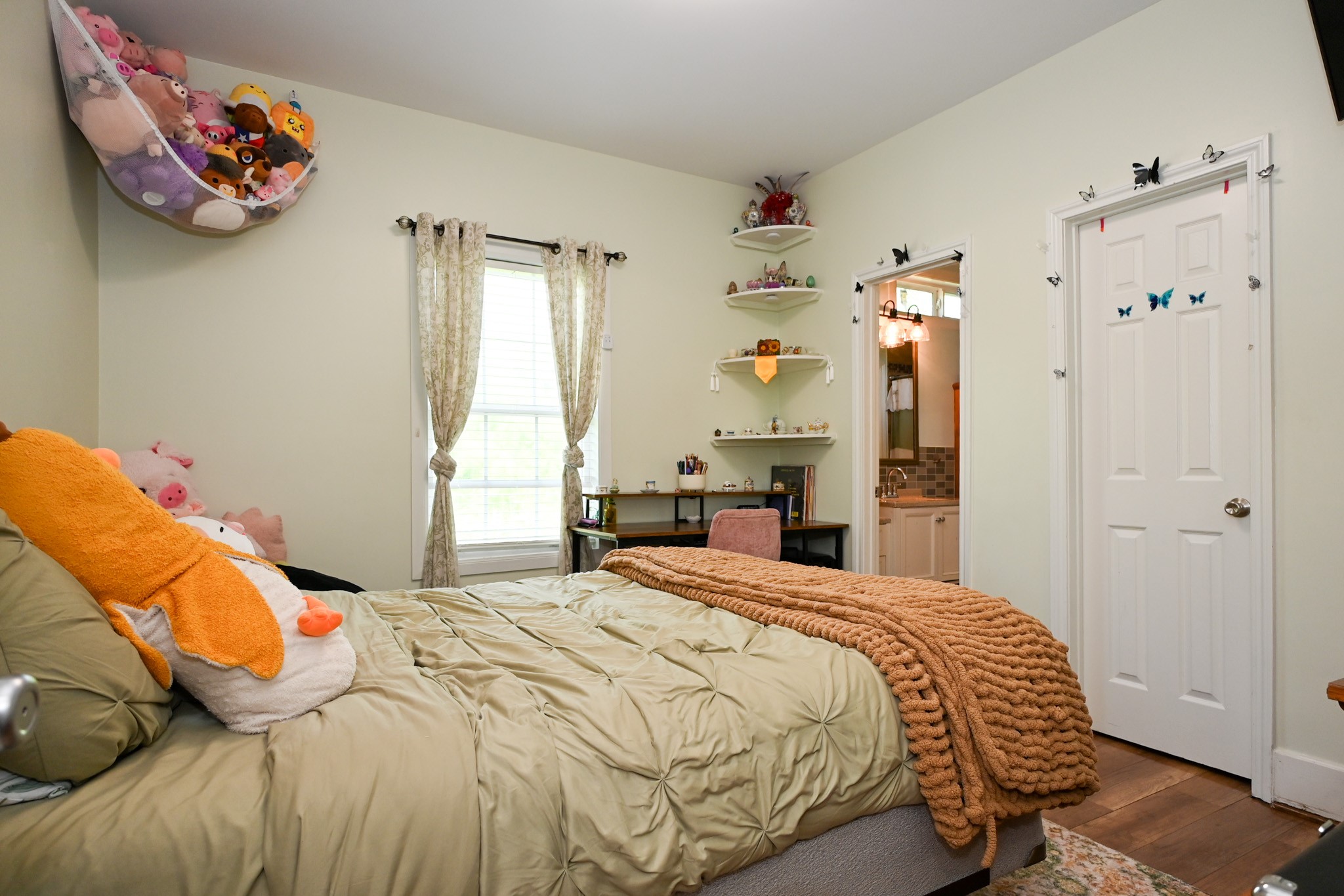 1229 County Road 2209N Cleveland, TX 77327 - Photo 17 of 43 a bedroom with a bed and a painting on the wall