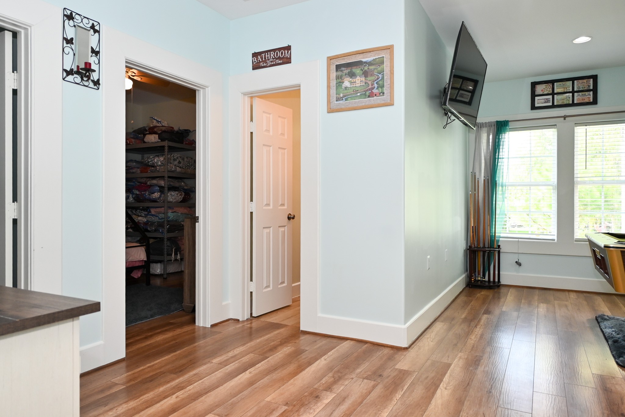 1229 County Road 2209N Cleveland, TX 77327 - Photo 21 of 43 a view of hallway with wooden floor and stairs