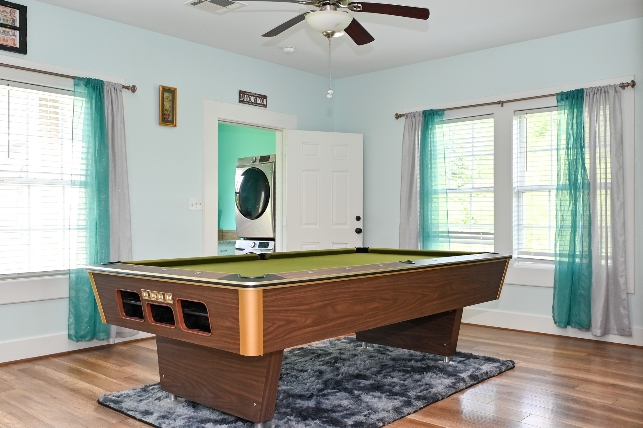 1229 County Road 2209N Cleveland, TX 77327 - Photo 32 of 43 a room with pool table and windows