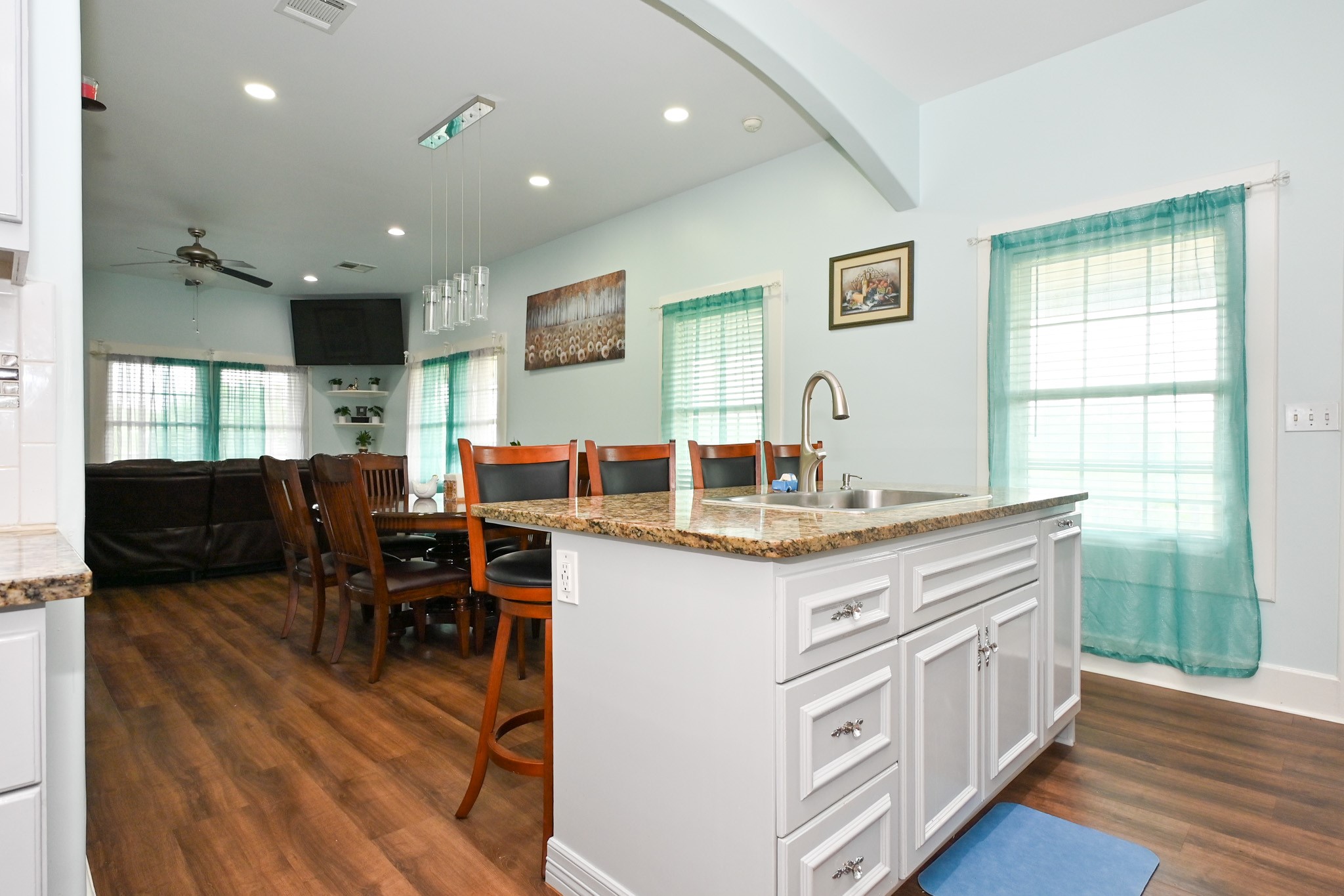1229 County Road 2209N Cleveland, TX 77327 - Photo 6 of 43 a kitchen with kitchen island granite countertop a sink and counter space