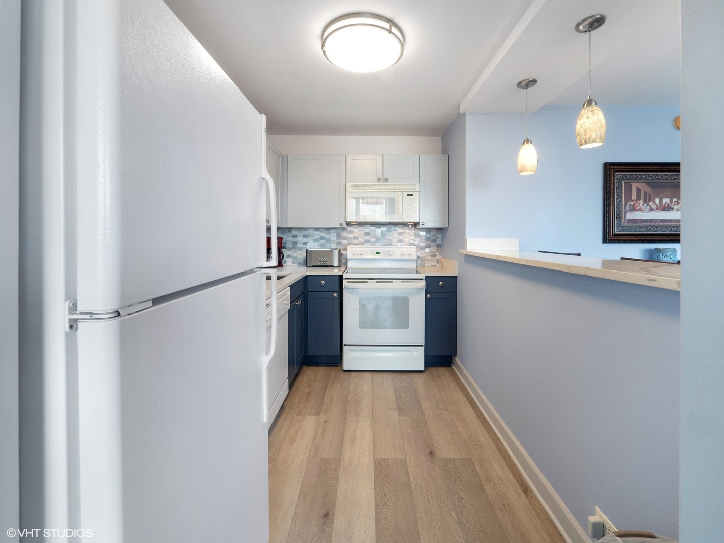 655 West Irving Park Road, Unit 1006 Chicago, IL 60613 - Photo 11 of 22 a kitchen with stainless steel appliances granite countertop a sink stove and refrigerator