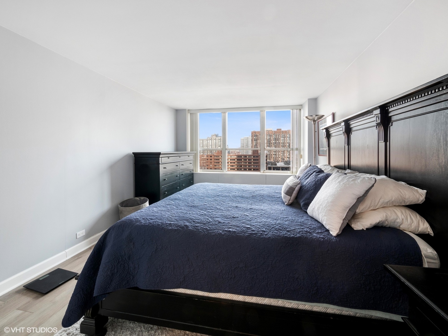 655 West Irving Park Road, Unit 1006 Chicago, IL 60613 - Photo 13 of 22 a bedroom with a bed and a window