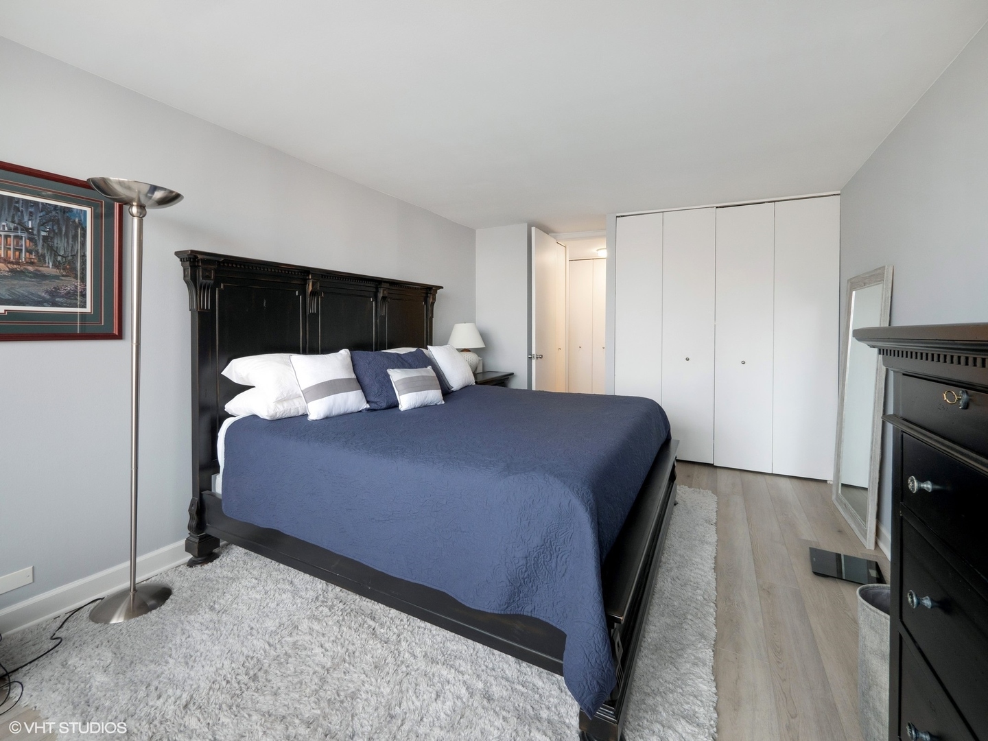 655 West Irving Park Road, Unit 1006 Chicago, IL 60613 - Photo 14 of 22 a bedroom with a bed and a television