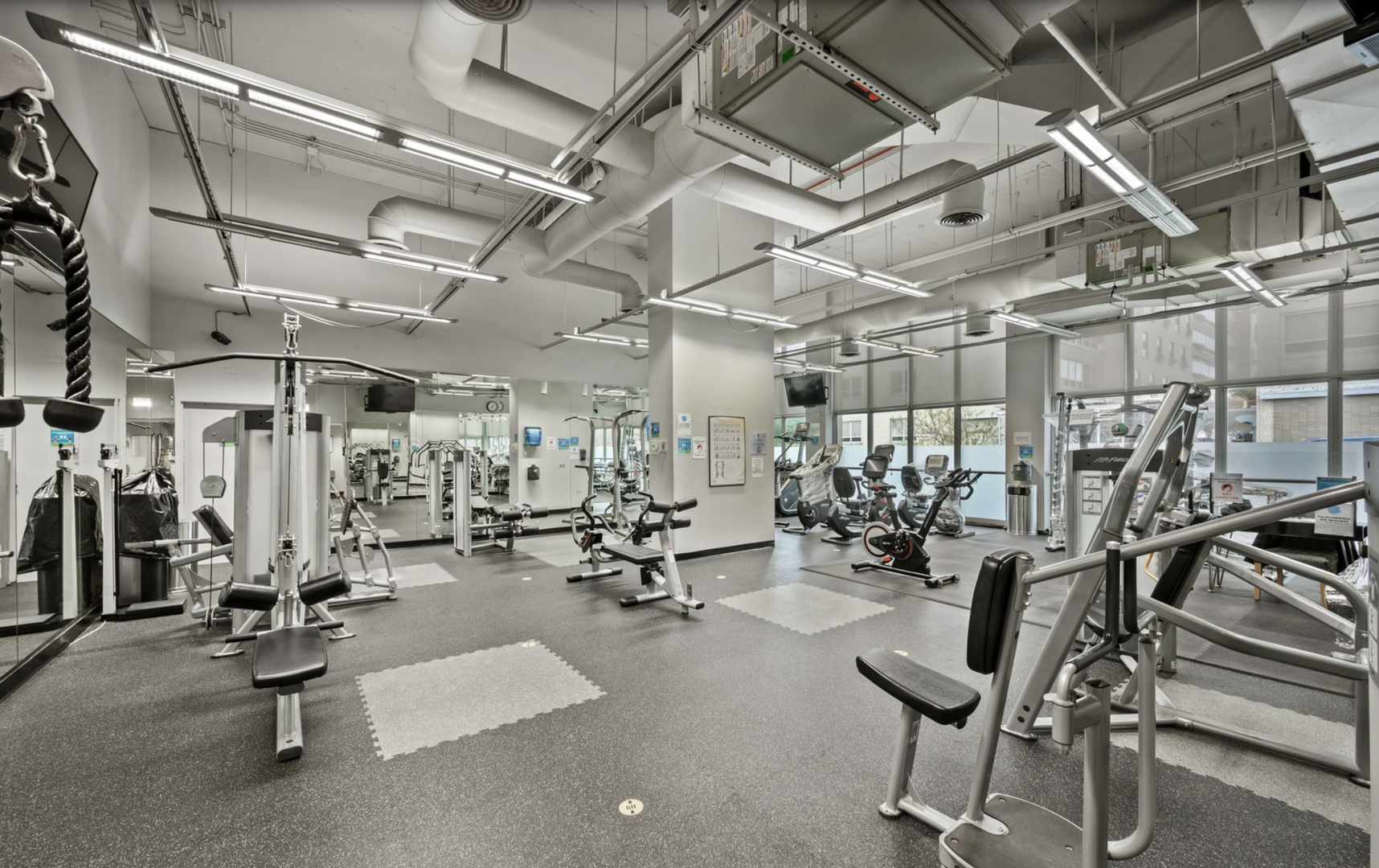 655 West Irving Park Road, Unit 1006 Chicago, IL 60613 - Photo 18 of 22 a view of a room with gym equipment