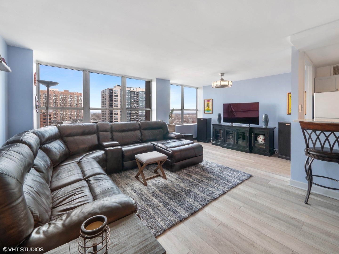 655 West Irving Park Road, Unit 1006 Chicago, IL 60613 - Photo 6 of 22 a living room with furniture and a flat screen tv