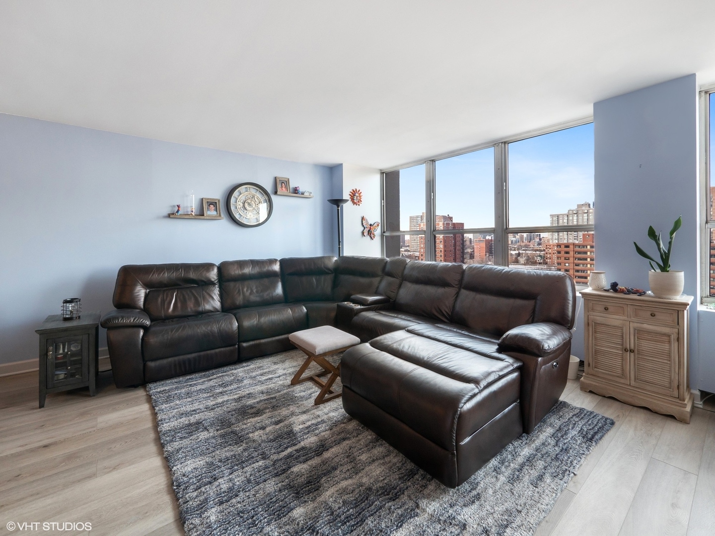 655 West Irving Park Road, Unit 1006 Chicago, IL 60613 - Photo 8 of 22 a living room with furniture and a large window
