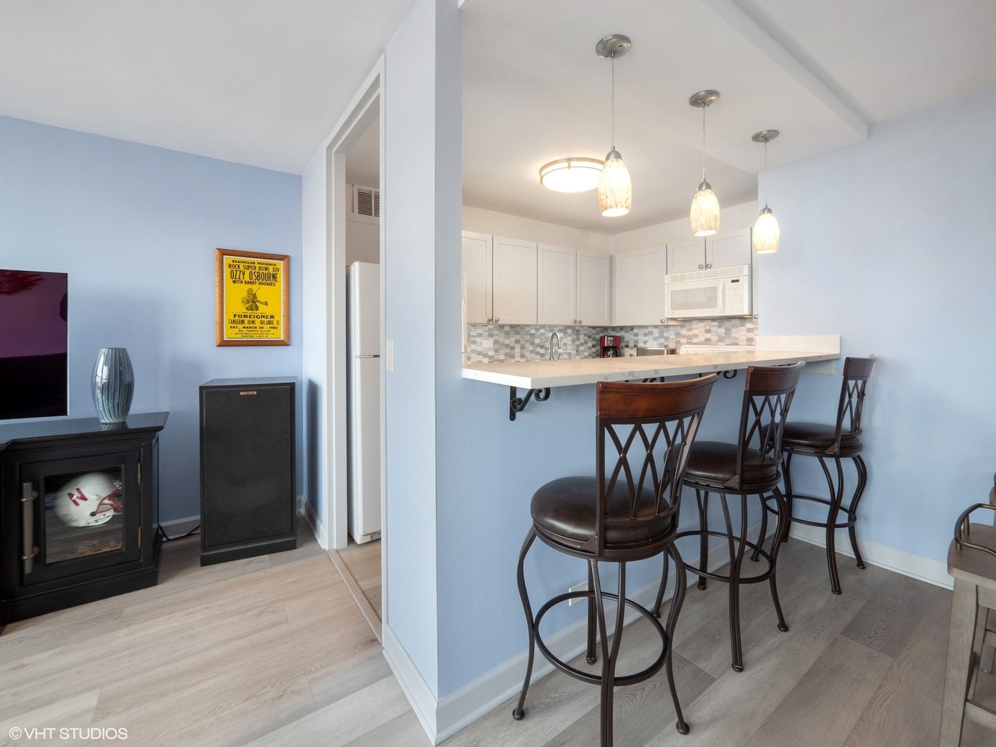 655 West Irving Park Road, Unit 1006 Chicago, IL 60613 - Photo 10 of 22 a view of a dining room with furniture and wooden floor