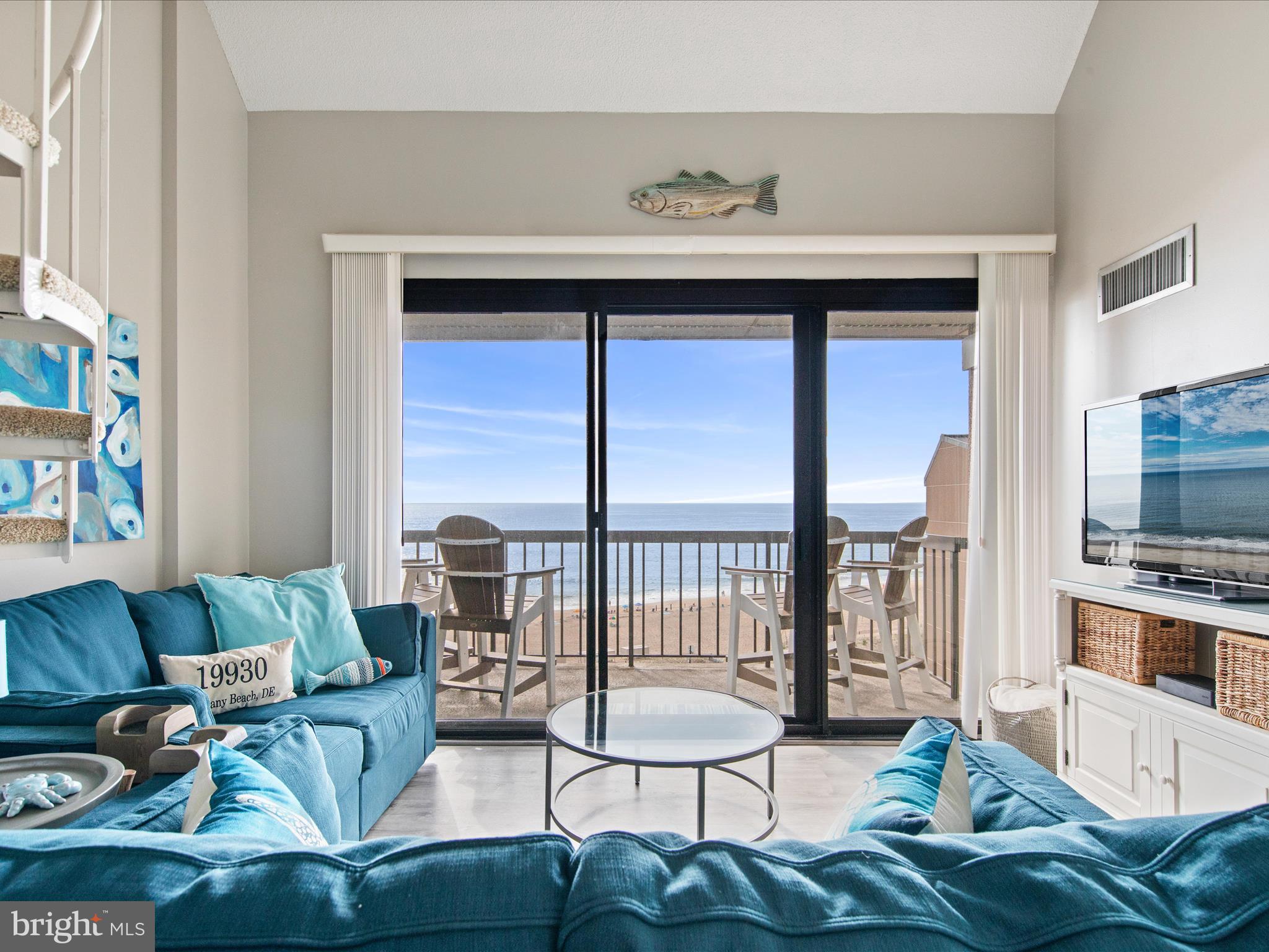 Ph03 Ph03 Farragut House Road, Unit PH03 Bethany Beach, DE 19930 - Photo 1 of 45 a living room with furniture and a flat screen tv