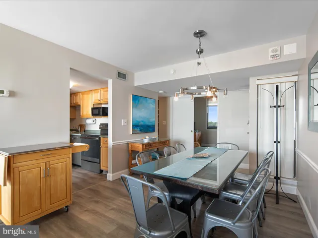 a dining room with a table and chairs