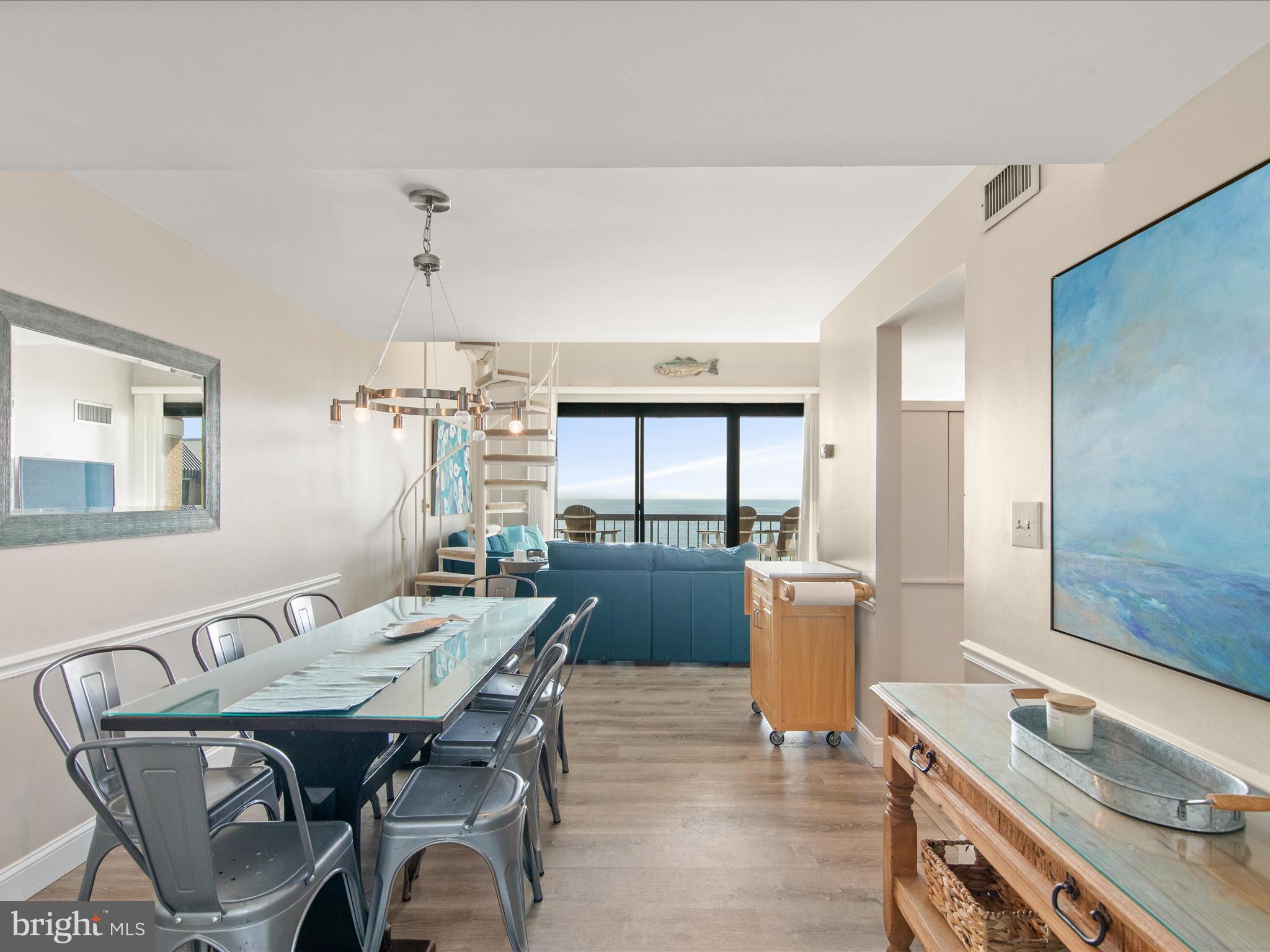 Ph03 Ph03 Farragut House Road, Unit PH03 Bethany Beach, DE 19930 - Photo 13 of 45 a kitchen with a table and chairs in it
