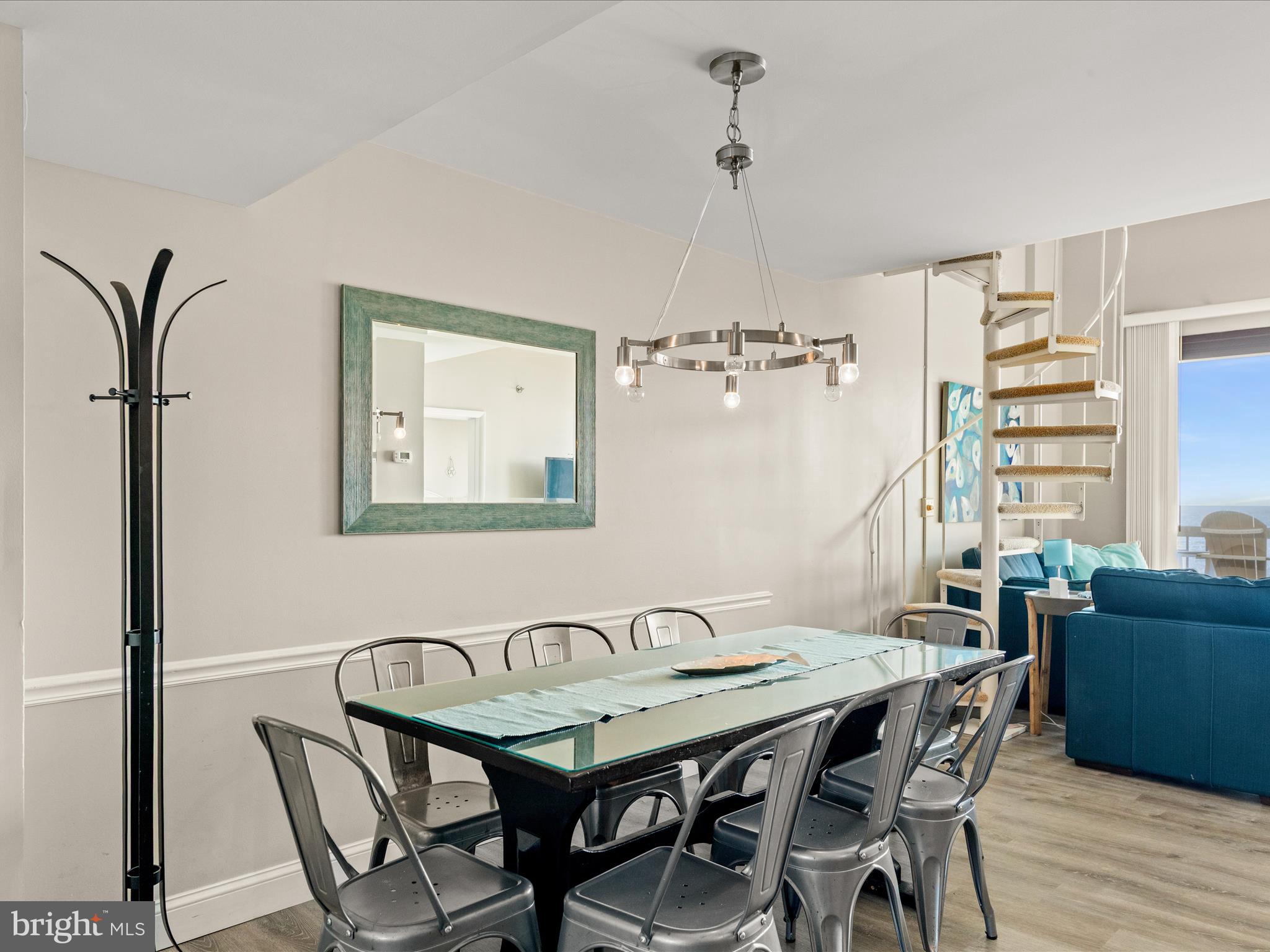 Ph03 Ph03 Farragut House Road, Unit PH03 Bethany Beach, DE 19930 - Photo 14 of 45 a view of a dining room with furniture