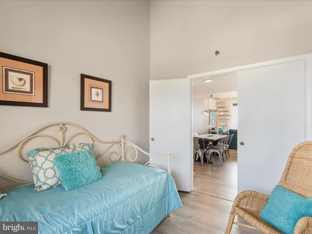 a bedroom with furniture and a window