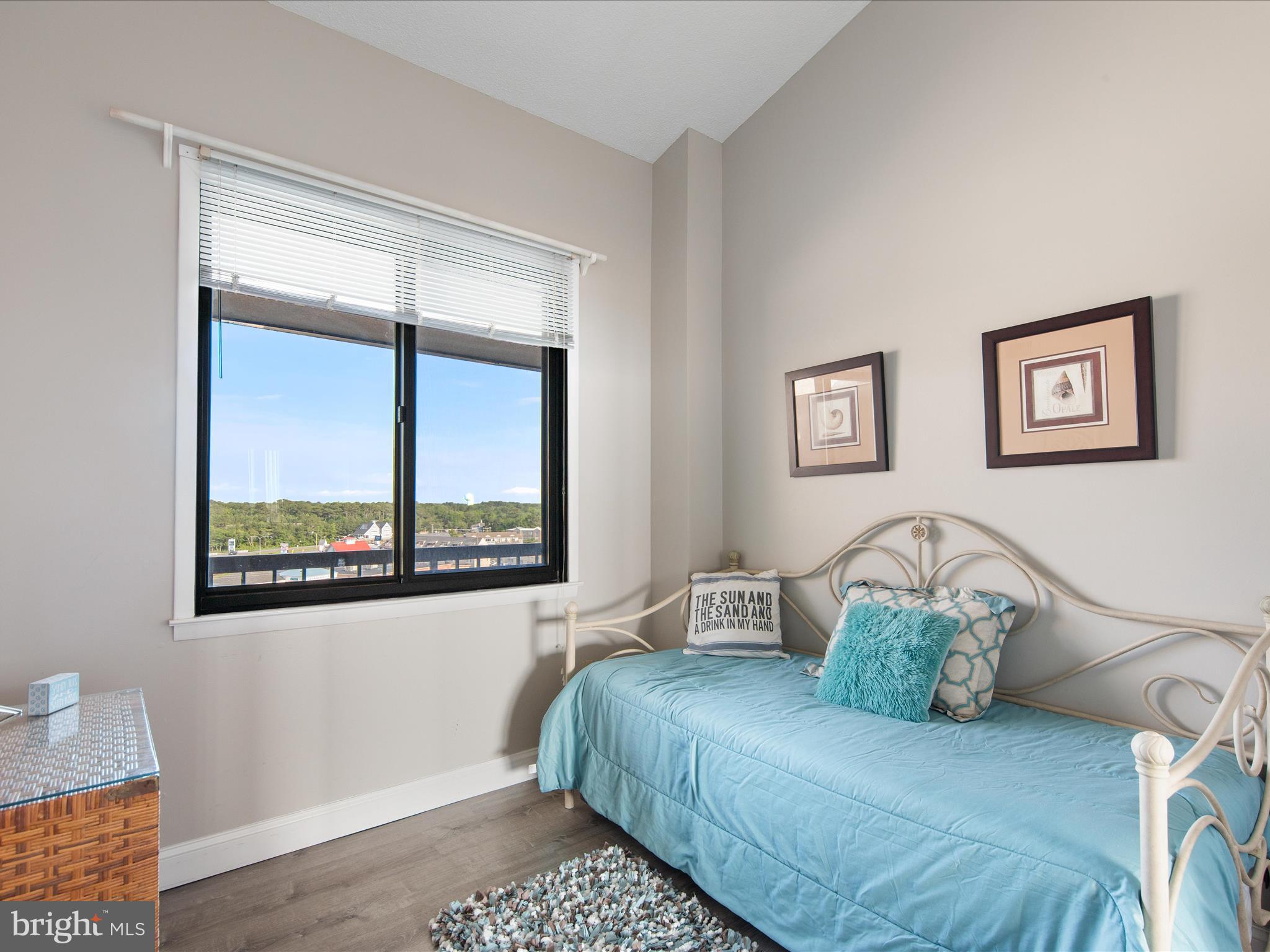 Ph03 Ph03 Farragut House Road, Unit PH03 Bethany Beach, DE 19930 - Photo 23 of 45 a bedroom with a large bed and a window