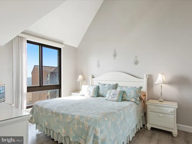 a bedroom with a bed and a chair