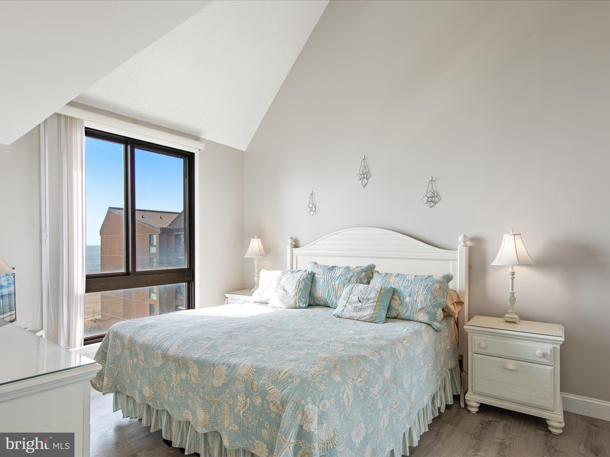 Ph03 Ph03 Farragut House Road, Unit PH03 Bethany Beach, DE 19930 - Photo 25 of 45 a bedroom with a bed and window