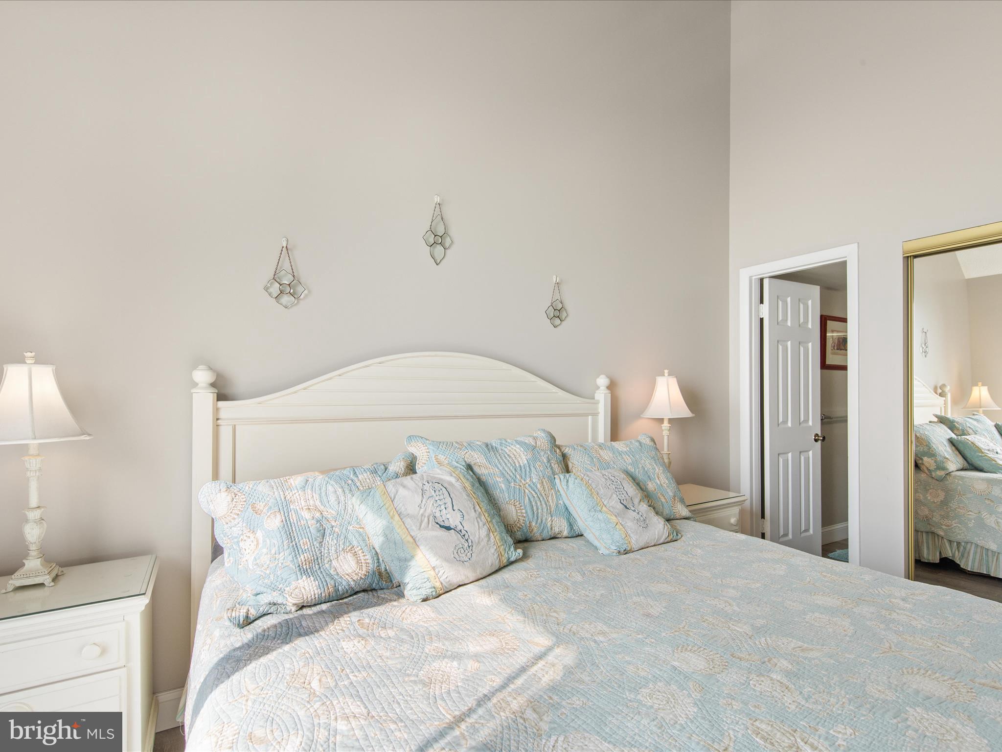 Ph03 Ph03 Farragut House Road, Unit PH03 Bethany Beach, DE 19930 - Photo 28 of 45 a bed with white sheets and pillows on it