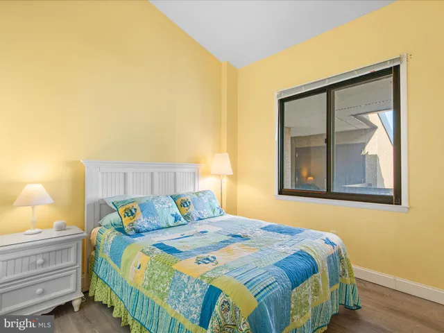 a bedroom with a bed and cabinet