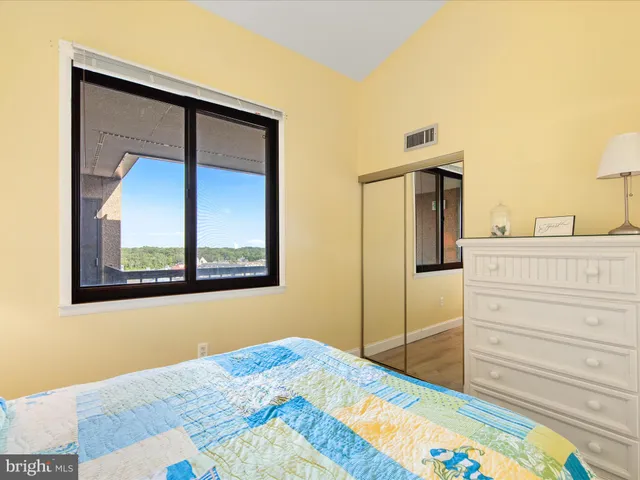 a bedroom with a bed and a cabinets