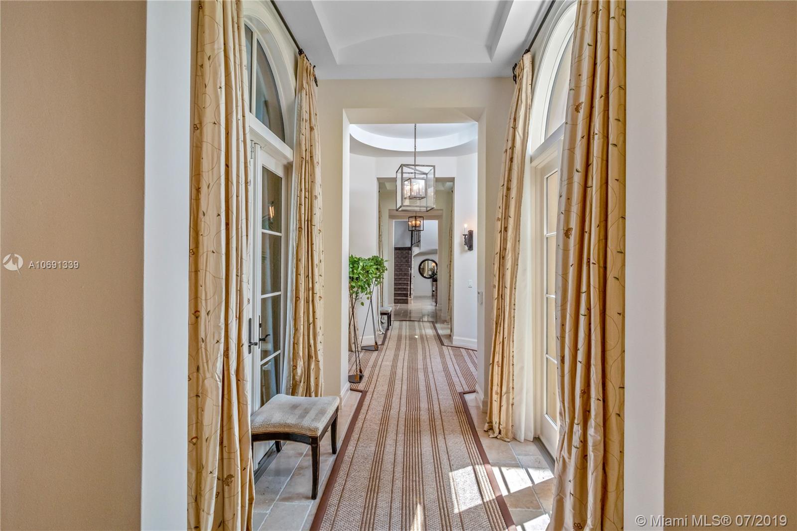 441 Island Drive Key Biscayne, FL 33149 - Photo 12 of 47 GREAT HALL LEADING TOWARDS LIBRARY AND FORMAL LIVING ROOM