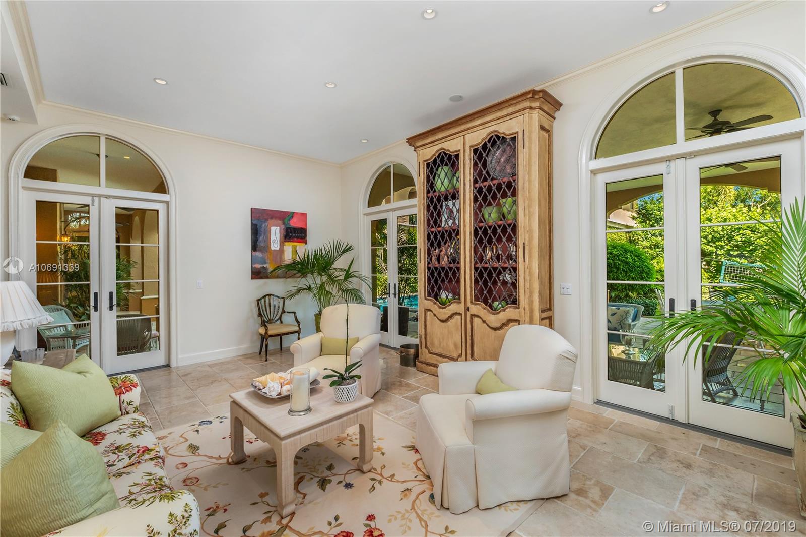441 Island Drive Key Biscayne, FL 33149 - Photo 15 of 47 FORMAL LIVING ROOM OPENS TO COVERED PATIO