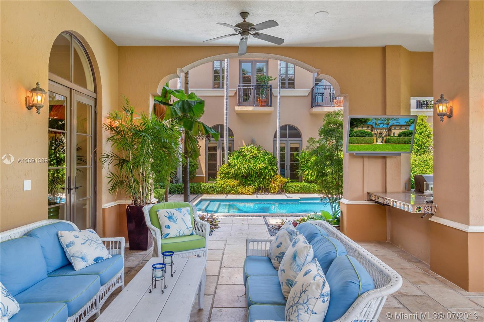 441 Island Drive Key Biscayne, FL 33149 - Photo 18 of 47 COVERED PATIO TOWARDS POOL