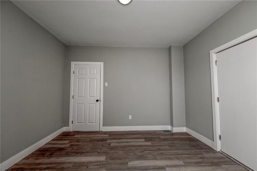 212 Ridge Avenue New Kensington, PA 15068 - Photo 15 of 32 a view of an empty room and wooden floor