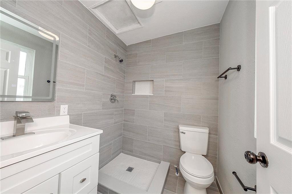 212 Ridge Avenue New Kensington, PA 15068 - Photo 21 of 32 a bathroom with a sink a toilet and shower