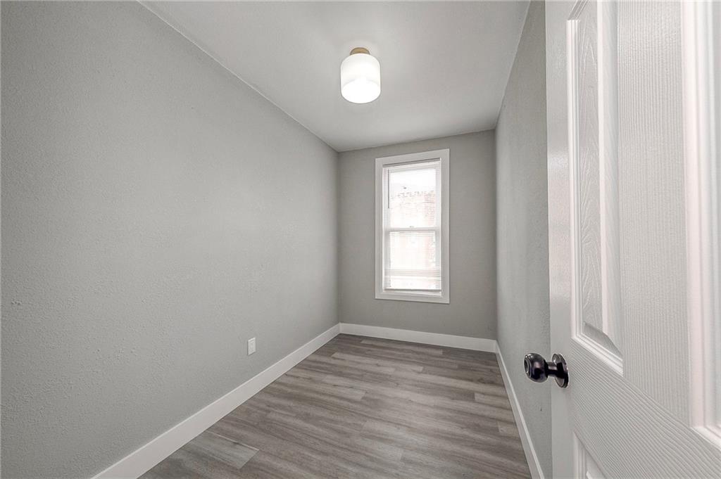 212 Ridge Avenue New Kensington, PA 15068 - Photo 22 of 32 wooden floor in an empty room with a window