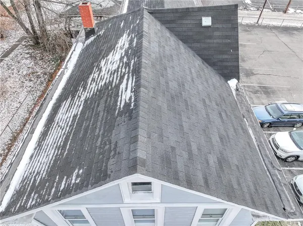 a front view of a house with parking