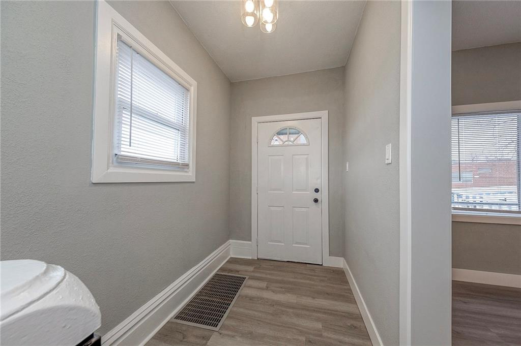 212 Ridge Avenue New Kensington, PA 15068 - Photo 3 of 32 a view of a room with wooden floor and windows