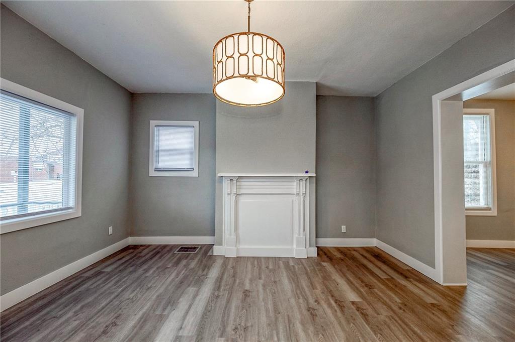 212 Ridge Avenue New Kensington, PA 15068 - Photo 4 of 32 an empty room with wooden floor and windows
