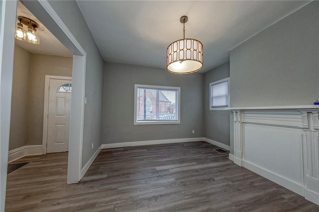 212 Ridge Avenue New Kensington, PA 15068 - Photo 5 of 32 an empty room with wooden floor and window
