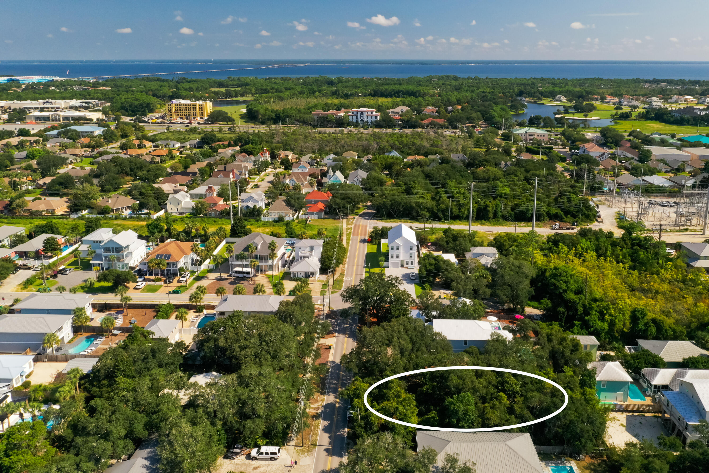 87 Dolphin Street Destin, FL 32541 - Photo 18 of 32 an aerial view of residential houses with outdoor space and trees