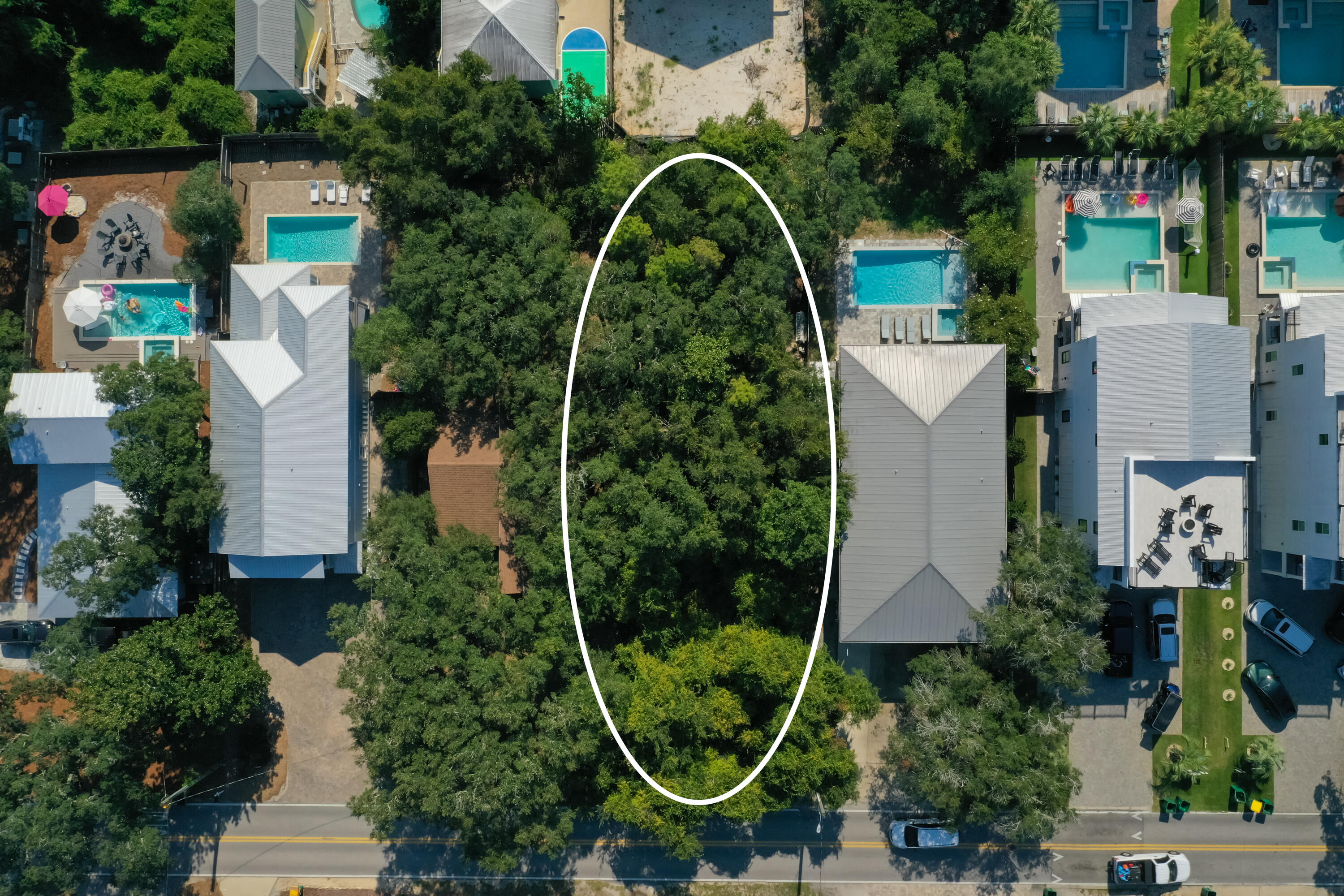 87 Dolphin Street Destin, FL 32541 - Photo 10 of 32 an aerial view of a house with a garden and trees
