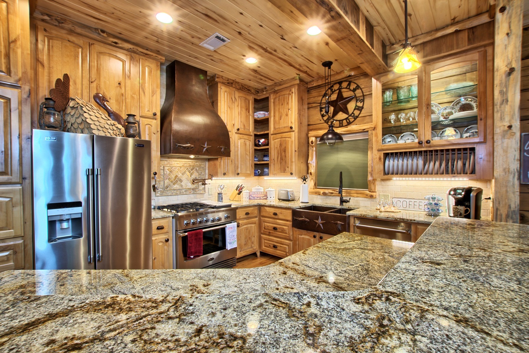 520 McCoury Loop Milam, TX 75959 - Photo 22 of 38 a kitchen with stainless steel appliances kitchen island granite countertop a refrigerator and stove