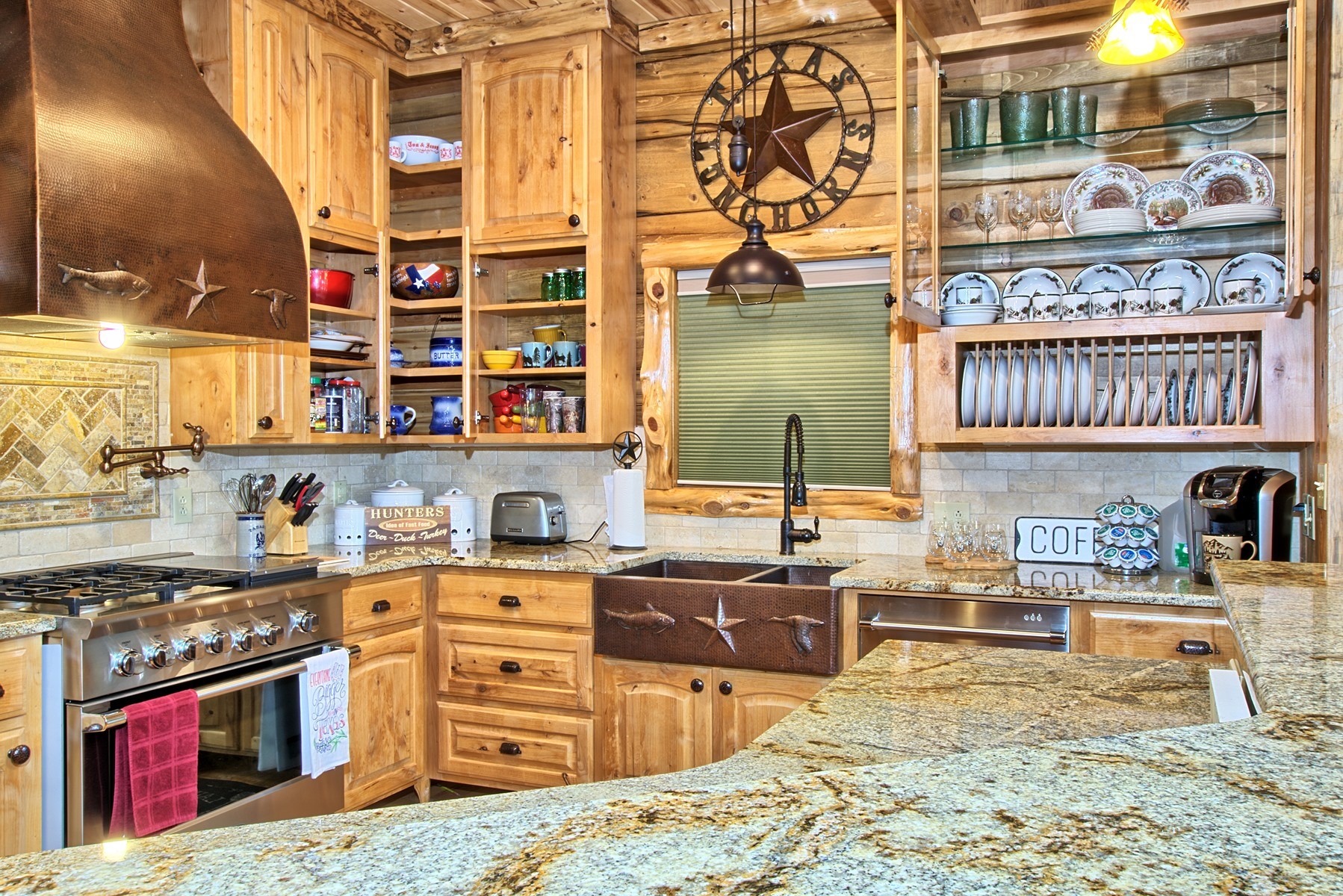 520 McCoury Loop Milam, TX 75959 - Photo 23 of 38 a kitchen with stainless steel appliances granite countertop a stove and cabinets