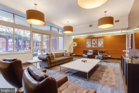 a view of a lobby area with wooden floor
