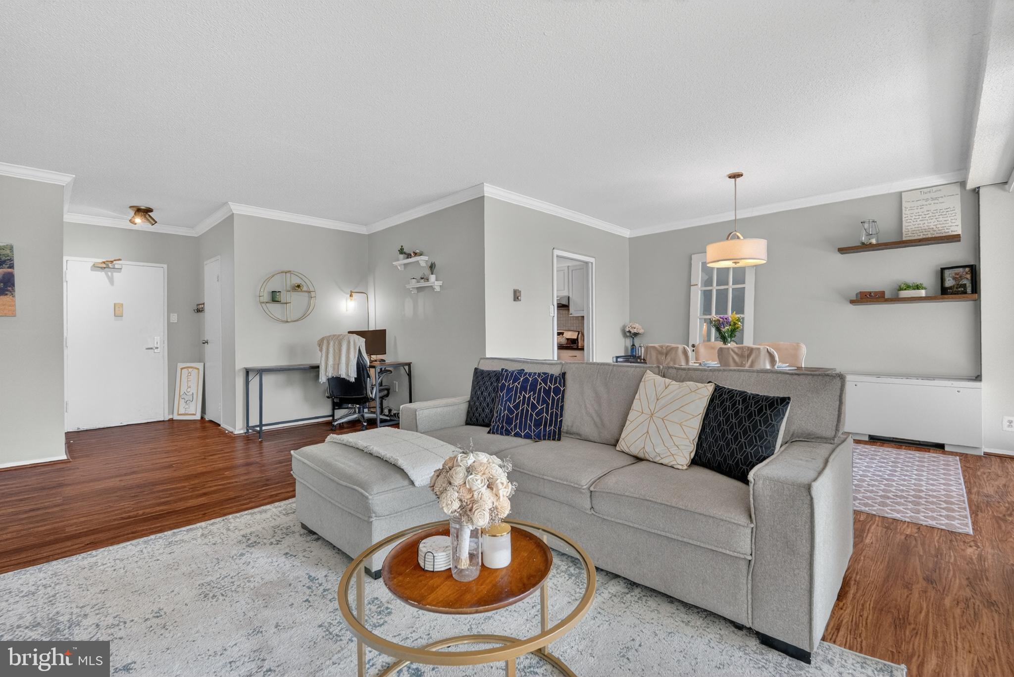 4141 North Henderson Road, Unit 302 Arlington, VA 22203 - Photo 20 of 40 a living room with furniture and a wooden floor