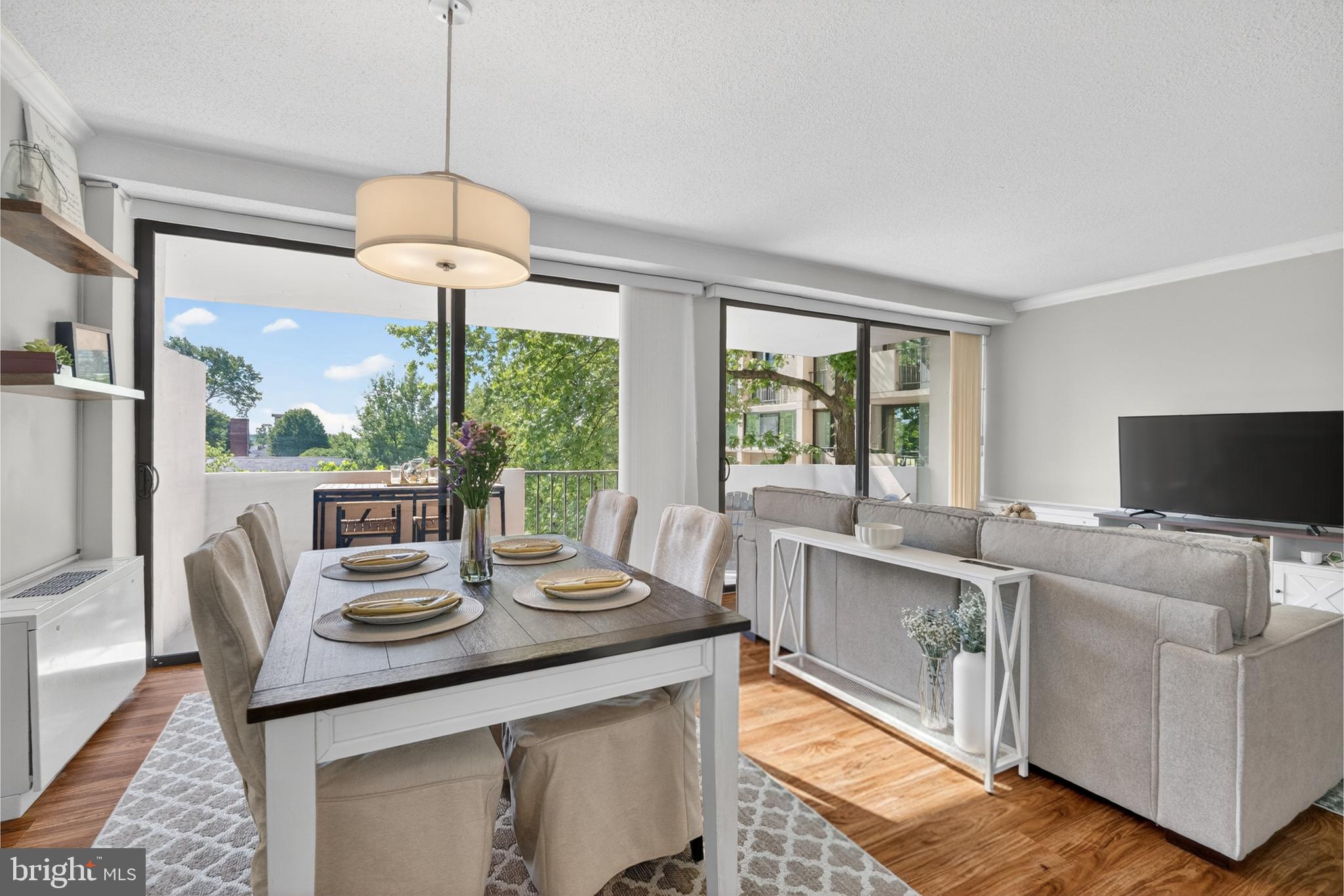 4141 North Henderson Road, Unit 302 Arlington, VA 22203 - Photo 5 of 40 a view of a dining room with furniture window and outside view