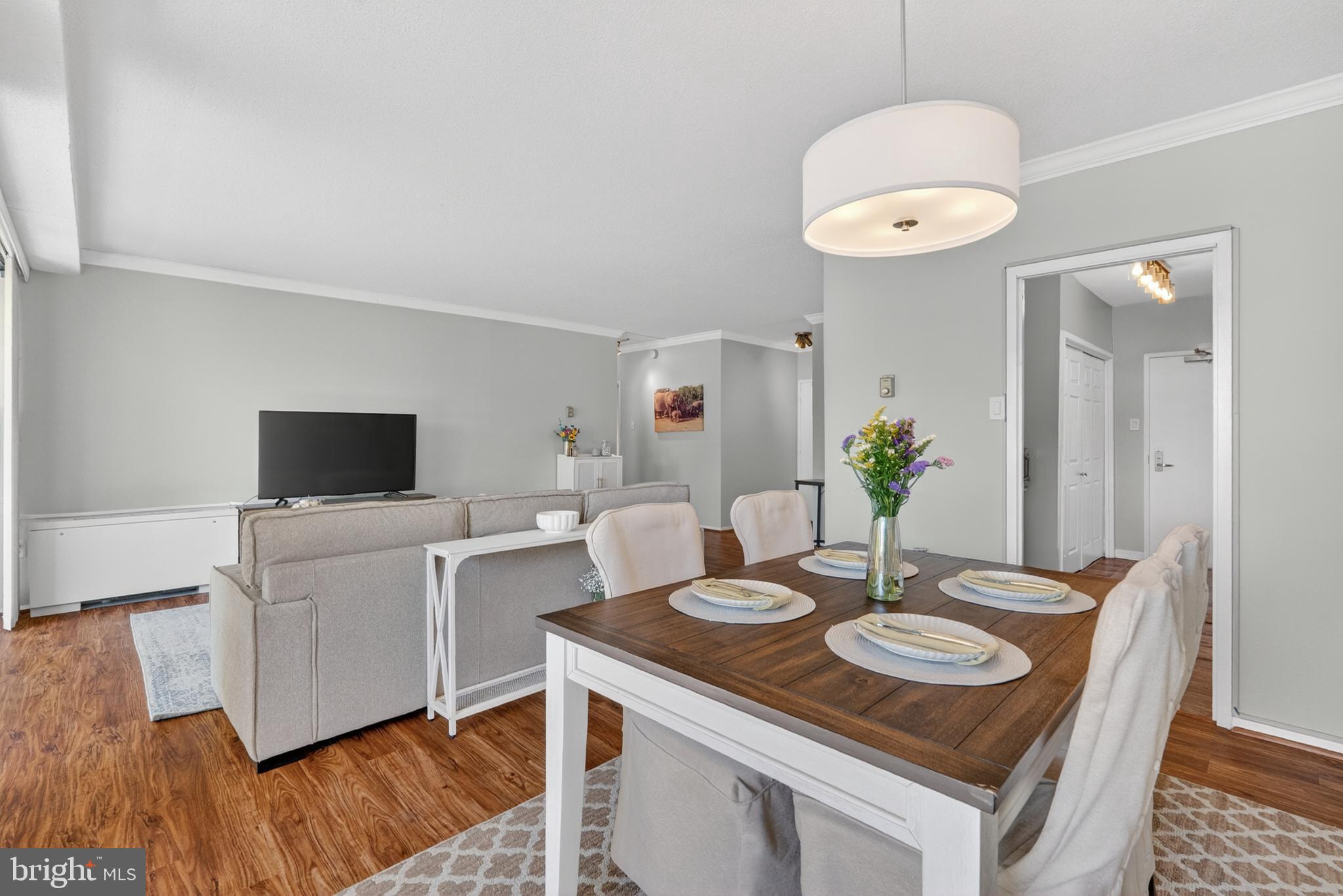 4141 North Henderson Road, Unit 302 Arlington, VA 22203 - Photo 8 of 40 a view of a dining room with furniture and wooden floor