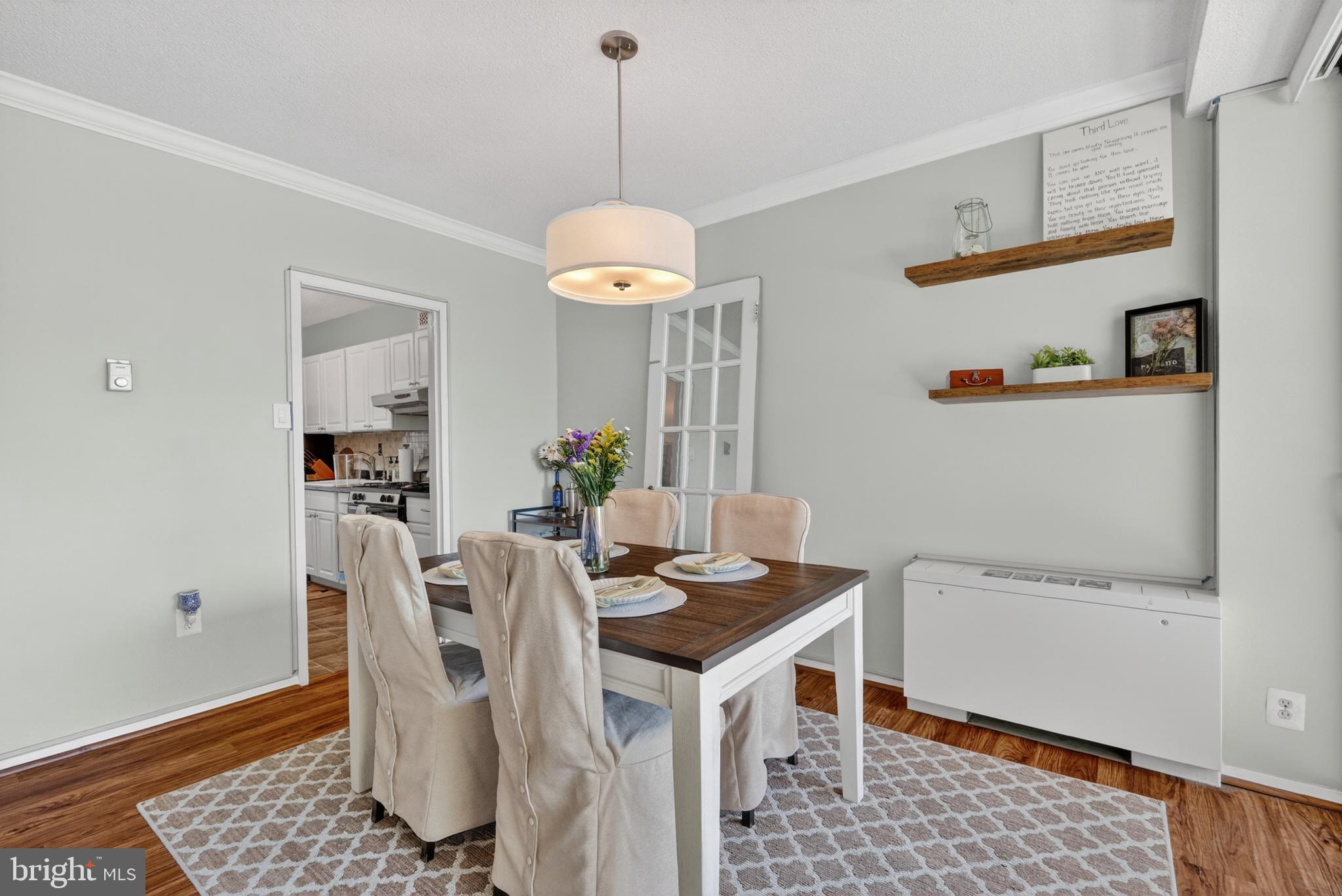 4141 North Henderson Road, Unit 302 Arlington, VA 22203 - Photo 9 of 40 a dining room with furniture and window
