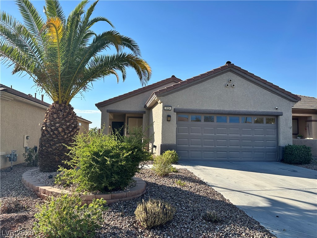 3024 Monroe Park Road Henderson, NV 89052 - Photo 1 of 1 A well-maintained desert landscape frames this welcoming single-story home with an attached 2 car, air conditioned garage.