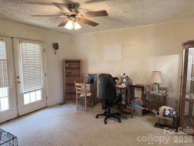 4084 Carpenters Cove Road Claremont, NC 28610 - Photo 7 of 27 a view of a workspace with furniture and a window